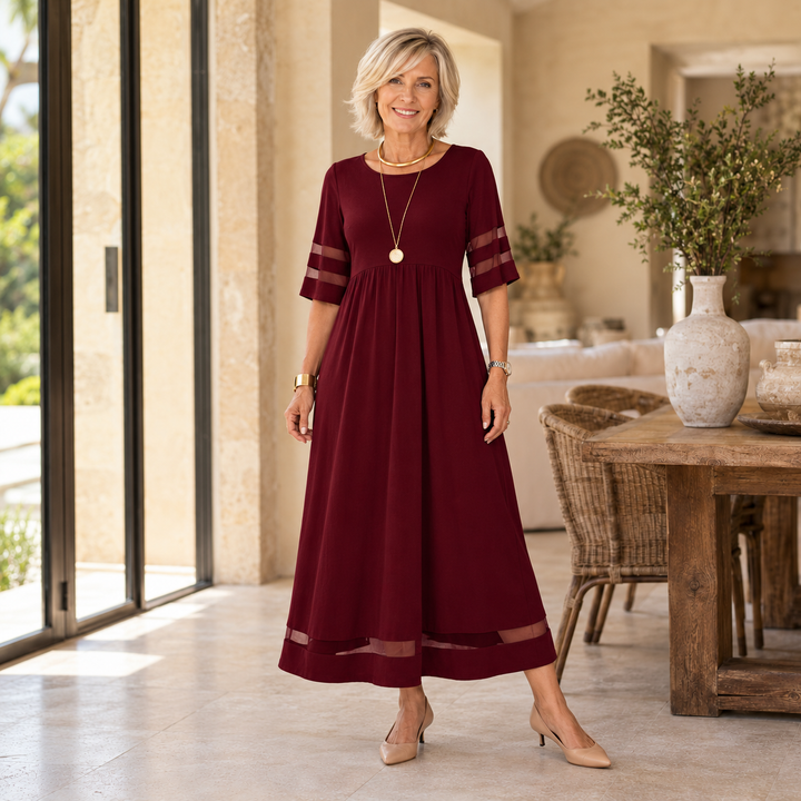 Aubrey midi dress in Red, worn by a mature blonde woman in a Mediterranean home