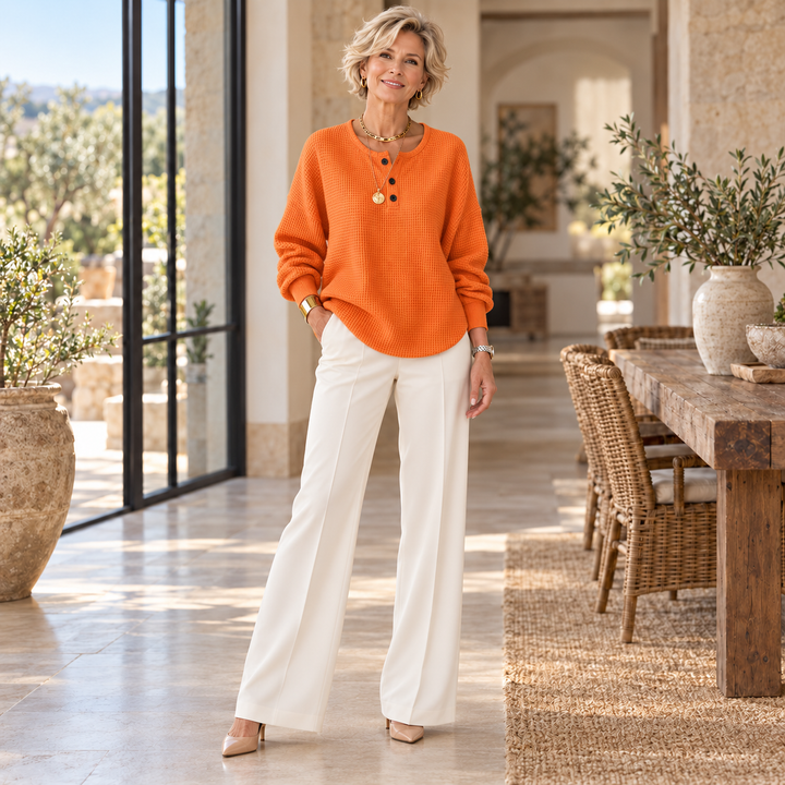 Mirabel™ | Cozy Waffle Henley Sweatshirt worn by a mature blonde woman in a sunlit Mediterranean home