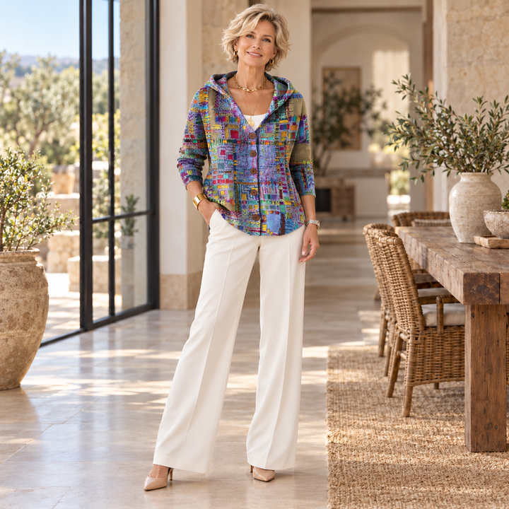 Patchouli™ | Artistic Cardigan worn by a mature blonde woman in a sunlit Mediterranean home