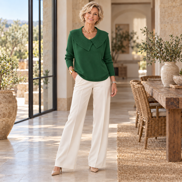 Sunnora™ | Warm Sweater with Soft Collar worn by a mature blonde woman in a sunlit Mediterranean home